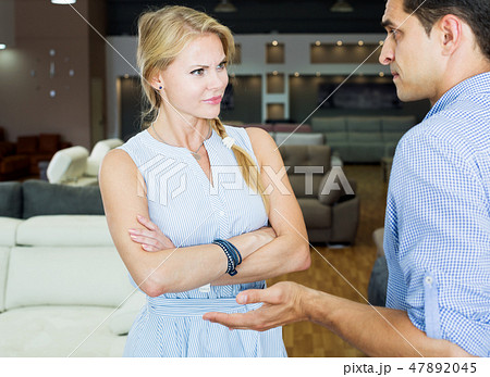 Woman unpleasantly surprised by prices for furniture 47892045
