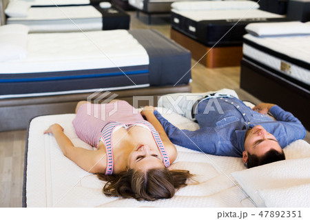Couple choosing mattress 47892351