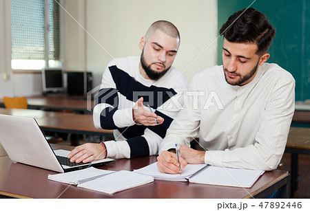 Students preparing for exams in classroom Students preparing for exams in classroom 47892446