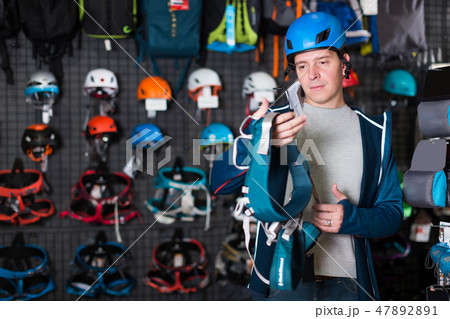shopper chooses a sports equipment 47892891