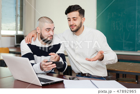 University students using mobile phone University students using mobile phone 47892965