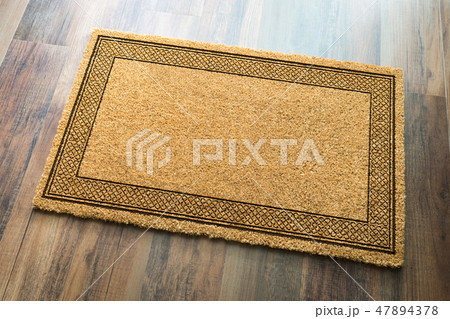 Blank Welcome Mat On Wood Floor Background  47894378