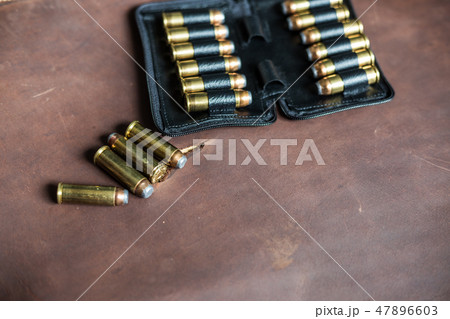 .44 magnum jacket soft point bullet on leather 47896603