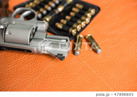 Revolver handgun with ammunition bullet 47896605