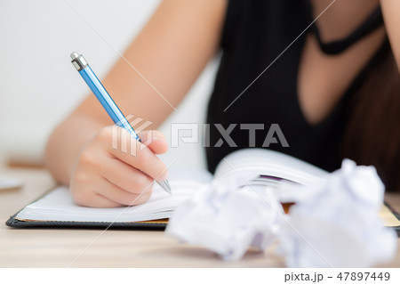 Closeup hand asian woman writer thinking idea Closeup hand asian woman writer thinking idea 47897449