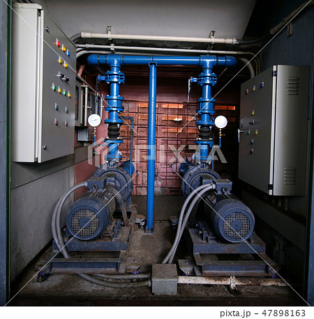 Electric motors driving water pump for building. 47898163