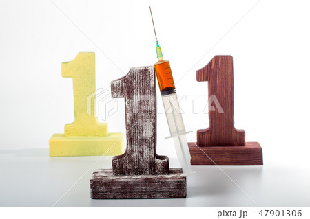 three digits one made of wood and syringe 47901306