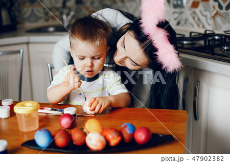 Mother with little son in a kitchen 47902382
