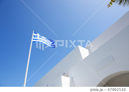 The Greek flag and hotel building, Santorini The Greek flag and hotel building, Santorini 47902530