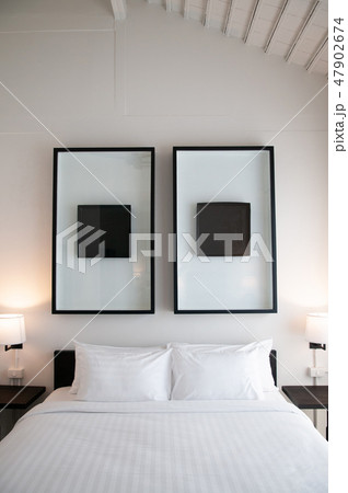 Asian contemporary hotel room with bed, pillows Asian contemporary hotel room with bed, pillows 47902674