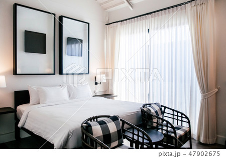 Asian contemporary hotel room with bed, pillows Asian contemporary hotel room with bed, pillows 47902675