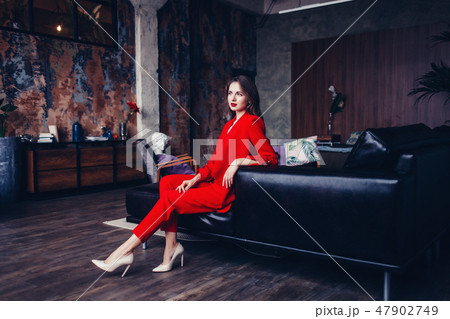 woman in formal red suit woman in formal red suit 47902749