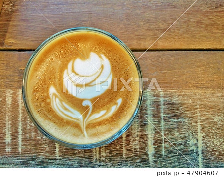 Cup of coffee on the table with Rose latte art. 47904607