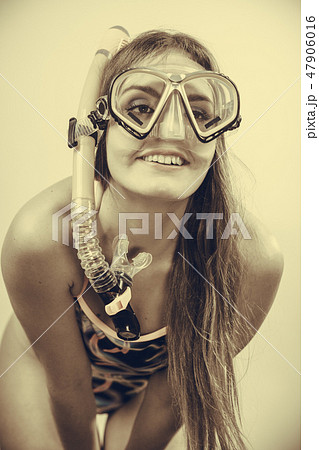 Woman with snorkeling mask having fun 47906016