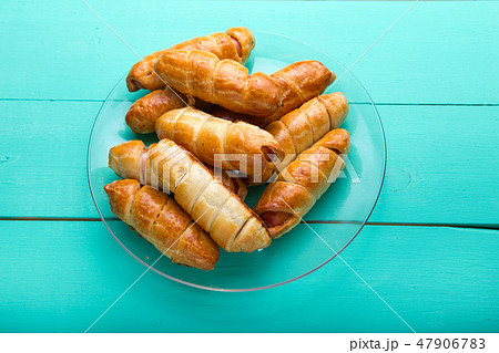 Sausage in the dough, homemade cakes, top view Sausage in the dough, homemade cakes, top view 47906783