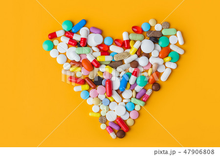 Heart made of pills - medical background 47906808