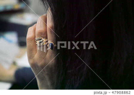 A female office worker busy on the phone A female office worker busy on the phone 47908862