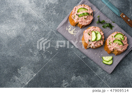 Sandwiches with chicken pate and cucumber Sandwiches with chicken pate and cucumber 47909514