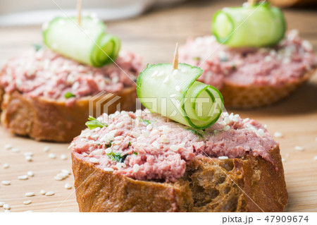 Sandwiches with chicken pate and cucumber  47909674