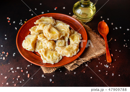 The boiled made dumplings with a stuffing  47909788