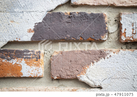 close up brick wall of red color with old cement  47911075