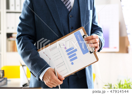 Male arm in suit show stats graphic clipped to pad Male arm in suit show stats graphic clipped to pad 47914544