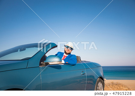 Successful young businessman on a beach 47915228
