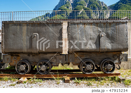 Two old mining carts with wheels on rails Two old mining carts with wheels on rails 47915234