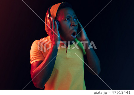 The young handsome hipster man listening music with headphones 47915441