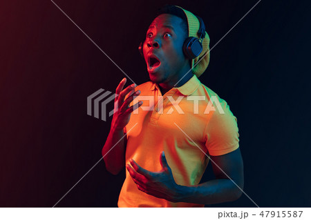 The young handsome hipster man listening music with headphones 47915587