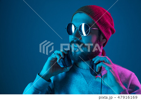 Enjoying his favorite music. 47916169