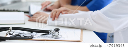 Stethoscope head lying on medical forms Stethoscope head lying on medical forms 47919343