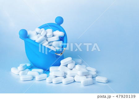 White tablets falling of purse, drugs and medicine 47920139