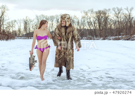Young girl and an elderly fisherman. Young girl and an elderly fisherman. 47920274