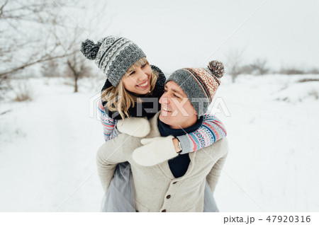 Happy Young Couple in Winter Park having fun.Family Outdoors. love Happy Young Couple in Winter Park having fun.Family Outdoors. love 47920316
