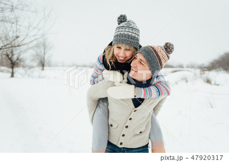 Happy Young Couple in Winter Park having fun.Family Outdoors. love Happy Young Couple in Winter Park having fun.Family Outdoors. love 47920317