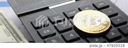 The bitcoin lies on the keyboard of the black 47920528