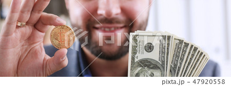 Young happy smiling businessman  holding 47920558