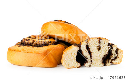 Two buns with poppy seeds and half on a white 47921623
