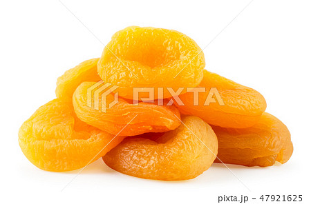 Heap of dried apricots closeup on a white 47921625
