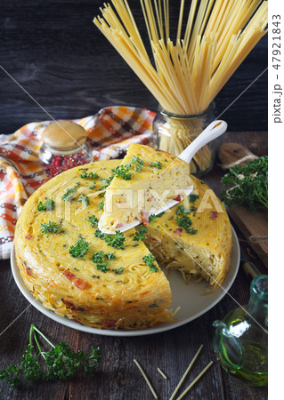 Spaghetti pie with lard, cheese and parsley  47921843
