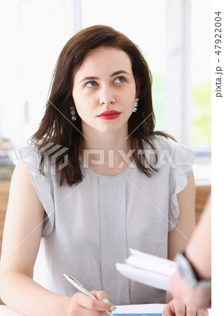 Female employee show pack of documents Female employee show pack of documents 47922004