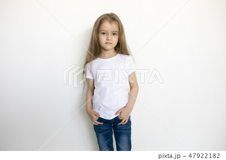 Cute little girl in white t-shirt. Mock-up. Cute little girl in white t-shirt. Mock-up. 47922182