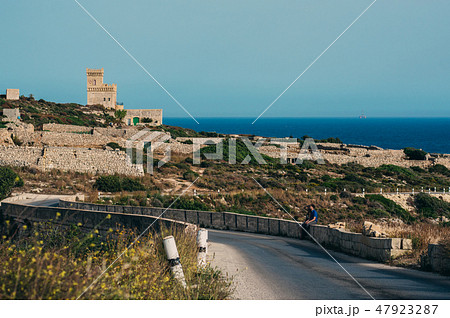 Man and woman sitting on the stone Man and woman sitting on the stone 47923287