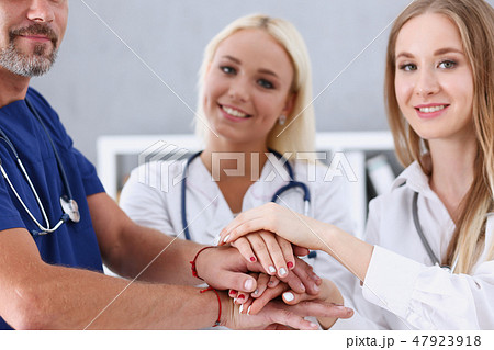 Group of doctor crossed arms in pile for win 47923918