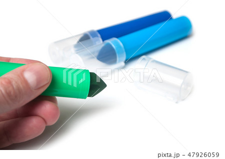 colorful felt pen in hand on white background 47926059