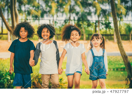 Happy kids group playing in the park in school. Happy kids group playing in the park in school. 47927797