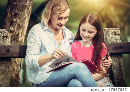 Happy mother and little kid daughter in park. 47927847