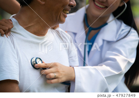 Friendly doctor taking care of senior man. Friendly doctor taking care of senior man. 47927849