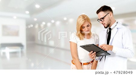 Doctor talking to patient in the hospital. 47928049